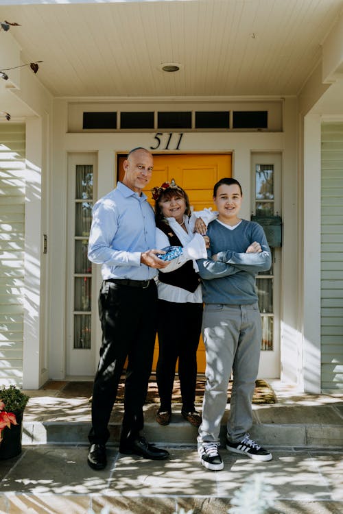 Family in front of their new rental.
